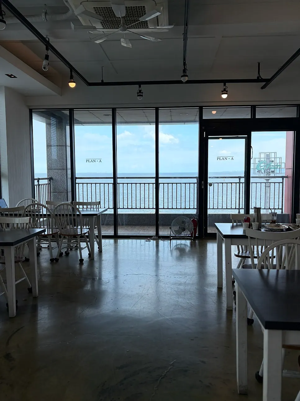 Window seats at Plan A Restaurant with a sea view