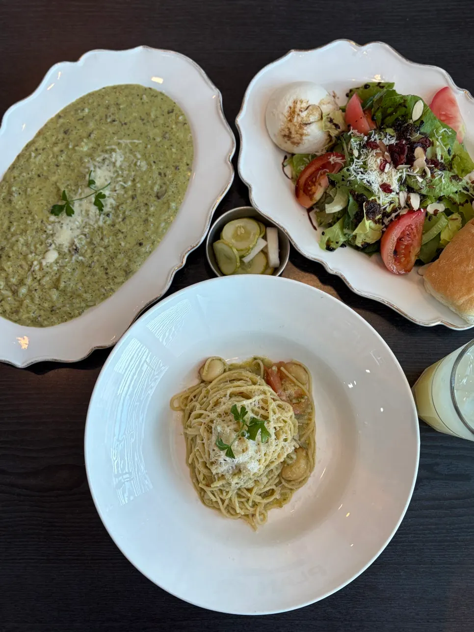 Pasta and risotto served together with the sea view in the background