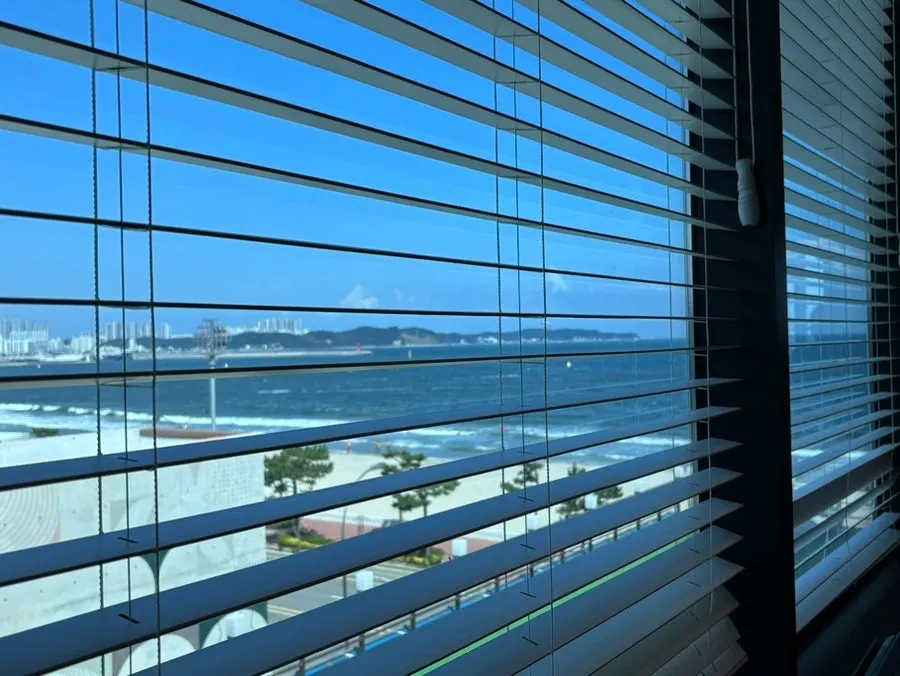 Window seats at Plan A Restaurant with a sea view through large windows