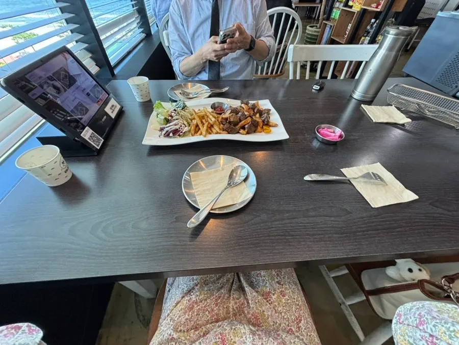 Chop steak served with a bowl of rice at Plan A Restaurant