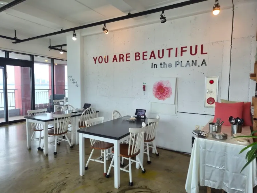 Spacious restaurant interior with white-toned decor