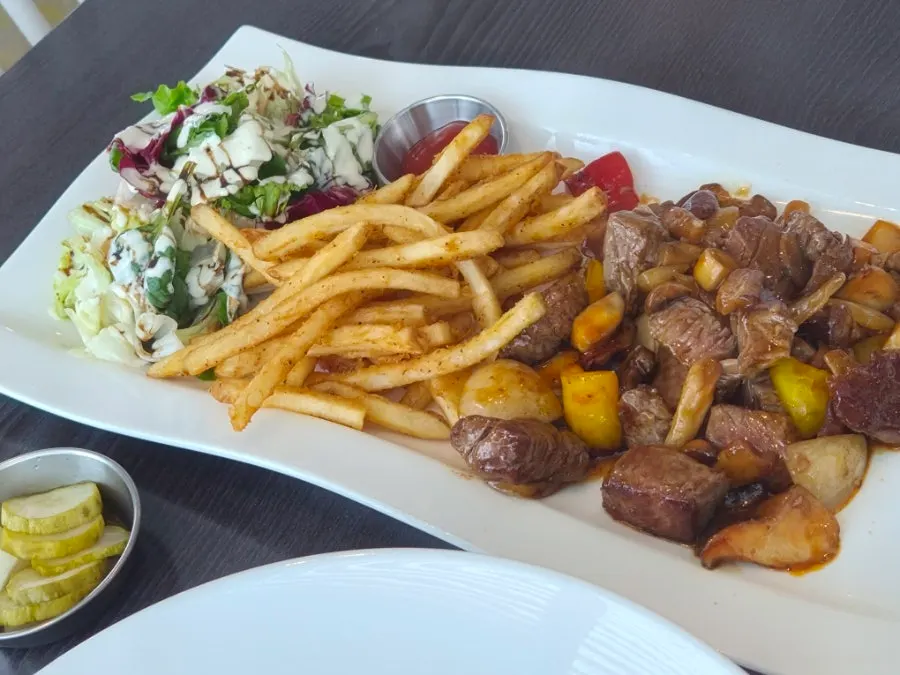 Chop steak and pasta on the table