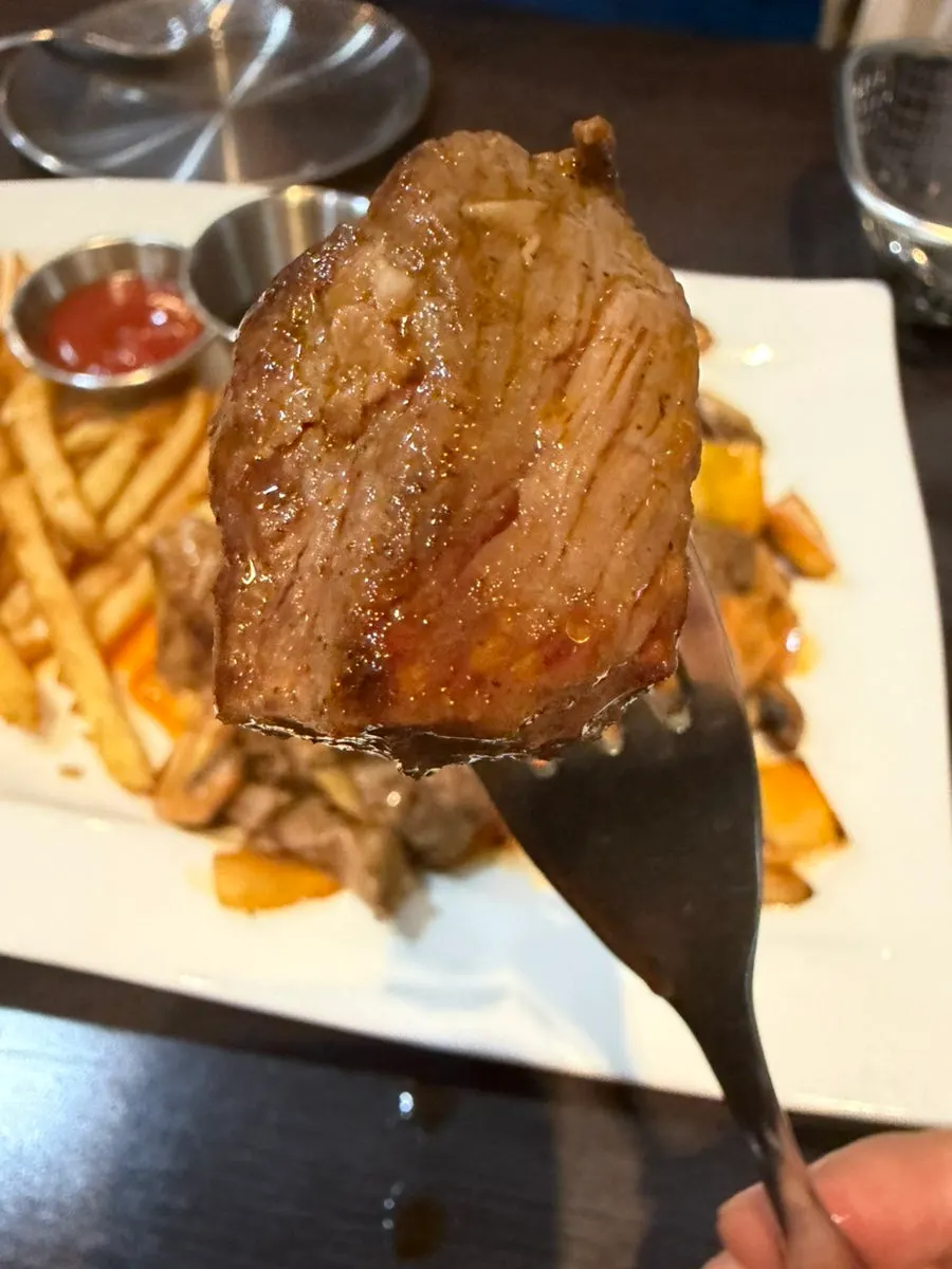 Close-up of chop steak cut into bite-sized pieces