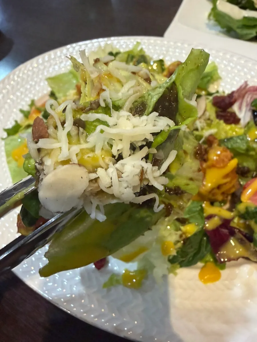 Chicken salad mixed with raisins and tomatoes