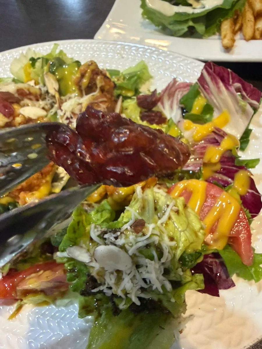 Vegetables in the chicken salad topped with cheese