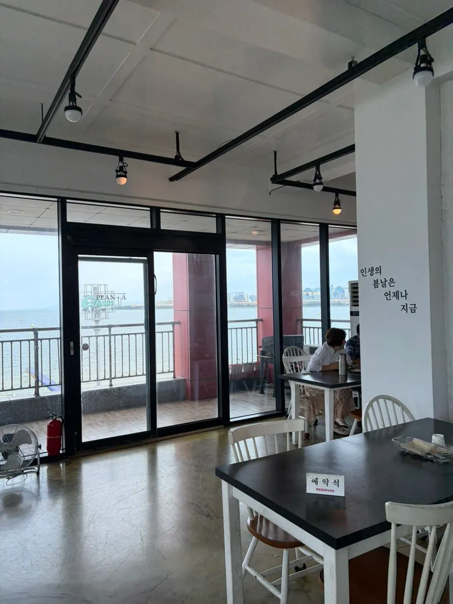 White-toned interior and table setting at Plan A Restaurant