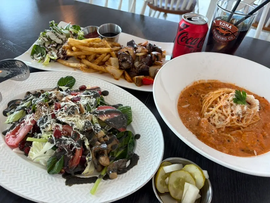 Sauce and vegetable salad served alongside the chop steak