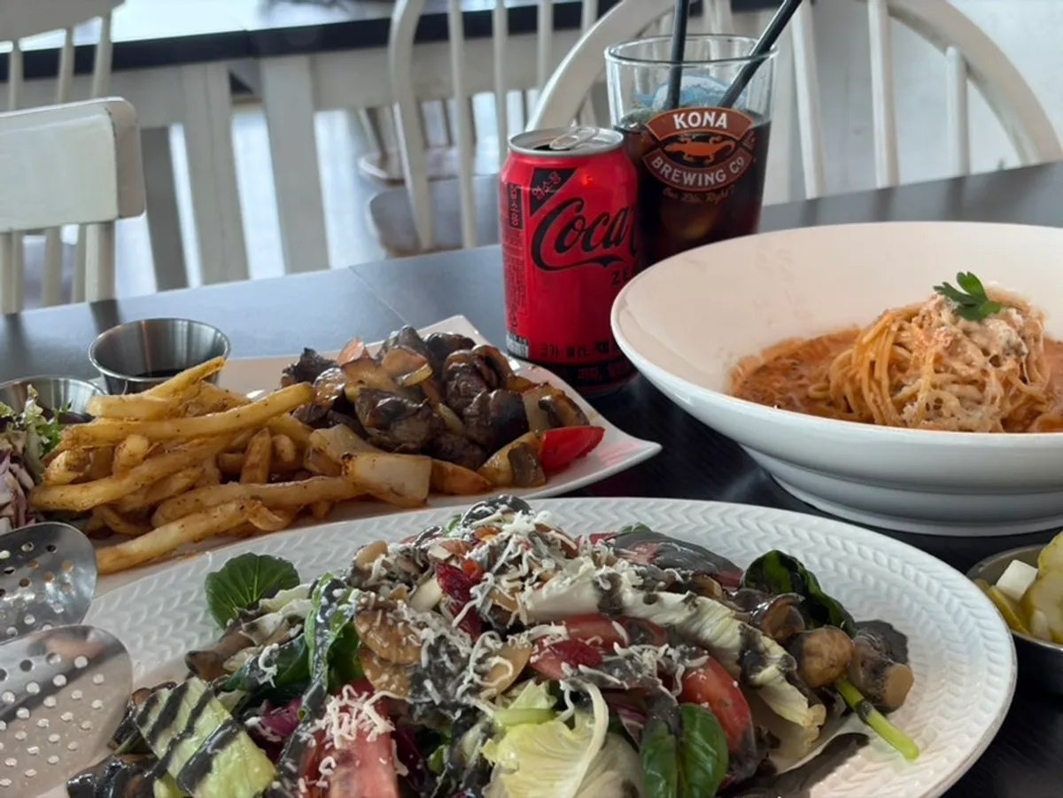 Three Western dishes set by the window with an ocean view