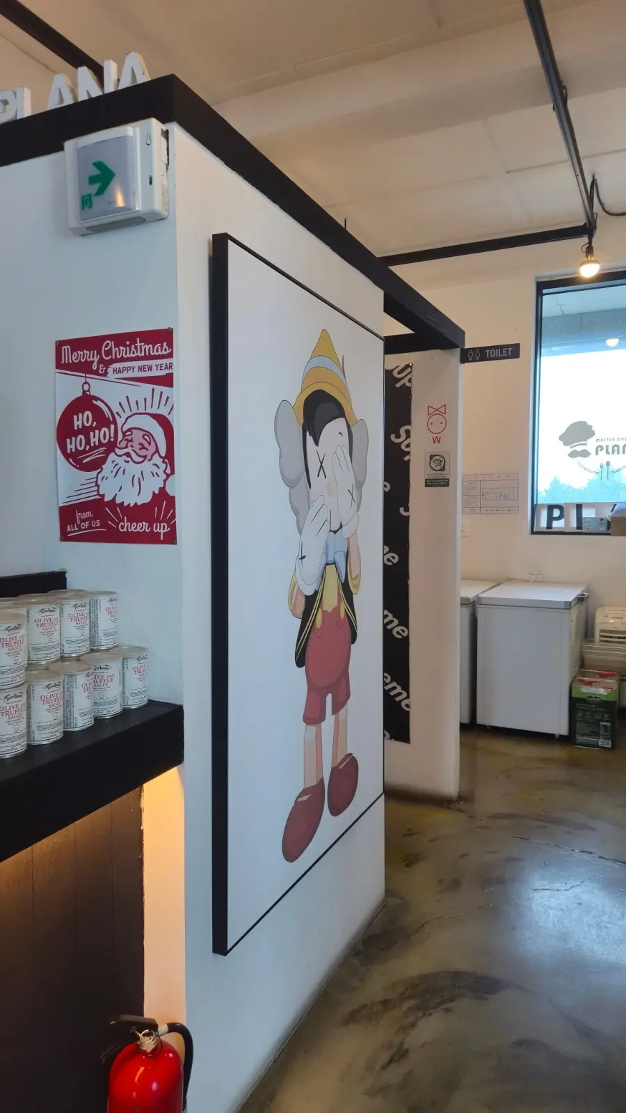 Gallery-like hallway inside Plan A Restaurant
