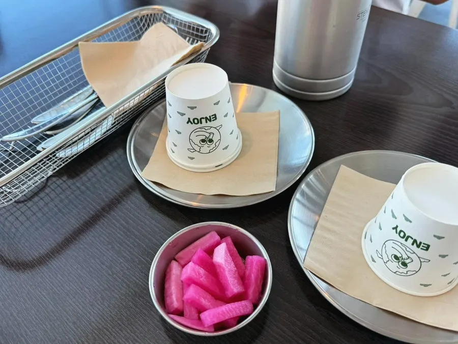 Radish pickle side dish and cutlery on the table