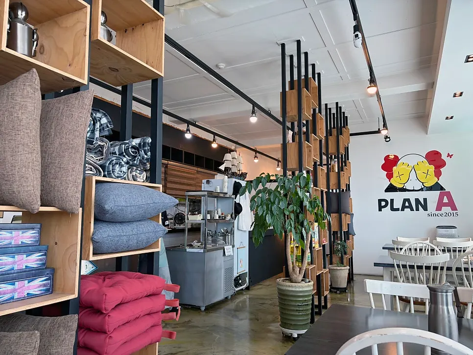 Interior of Plan A Restaurant with window seats fully occupied