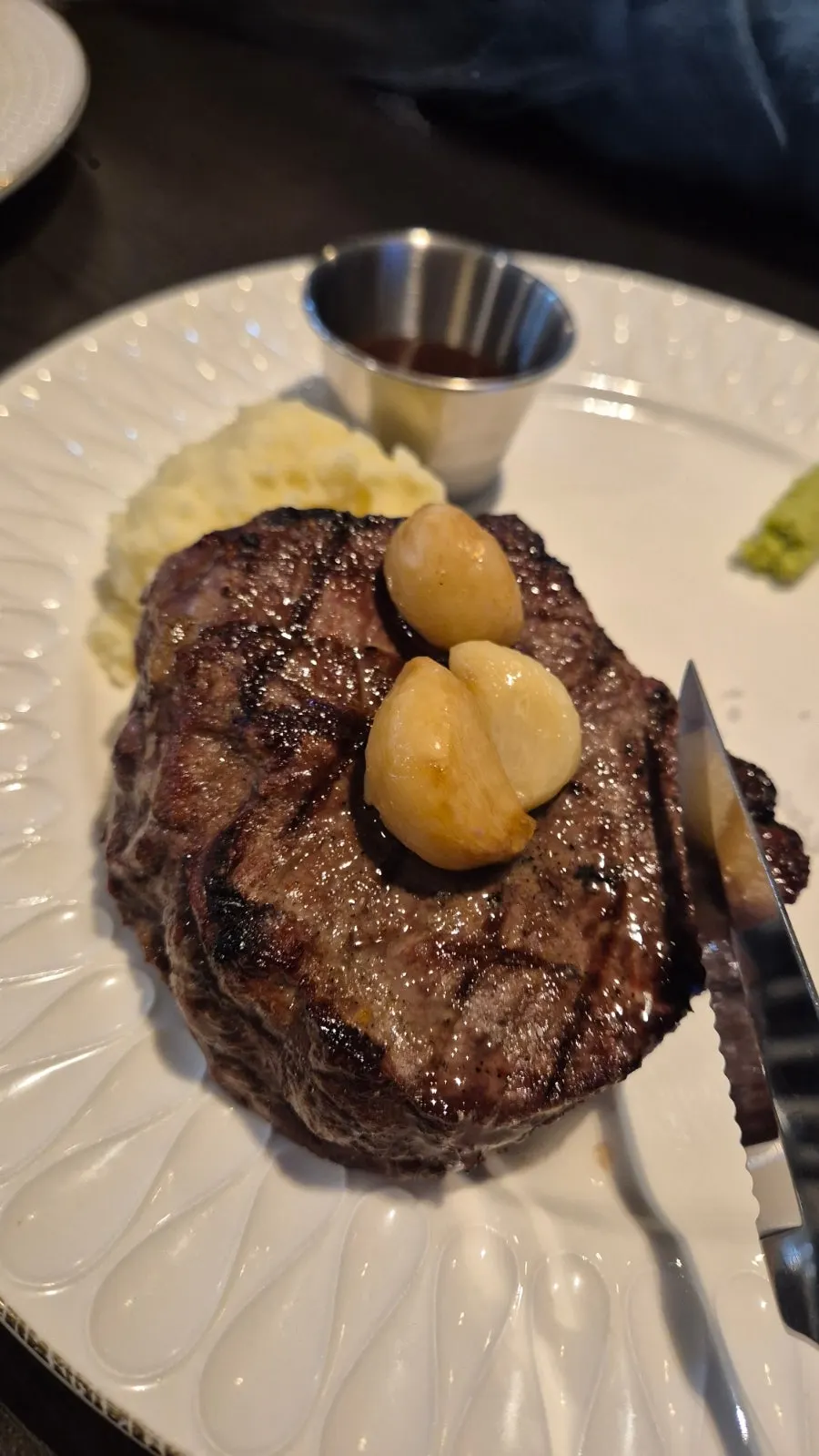 Steak plate set against the ocean backdrop
