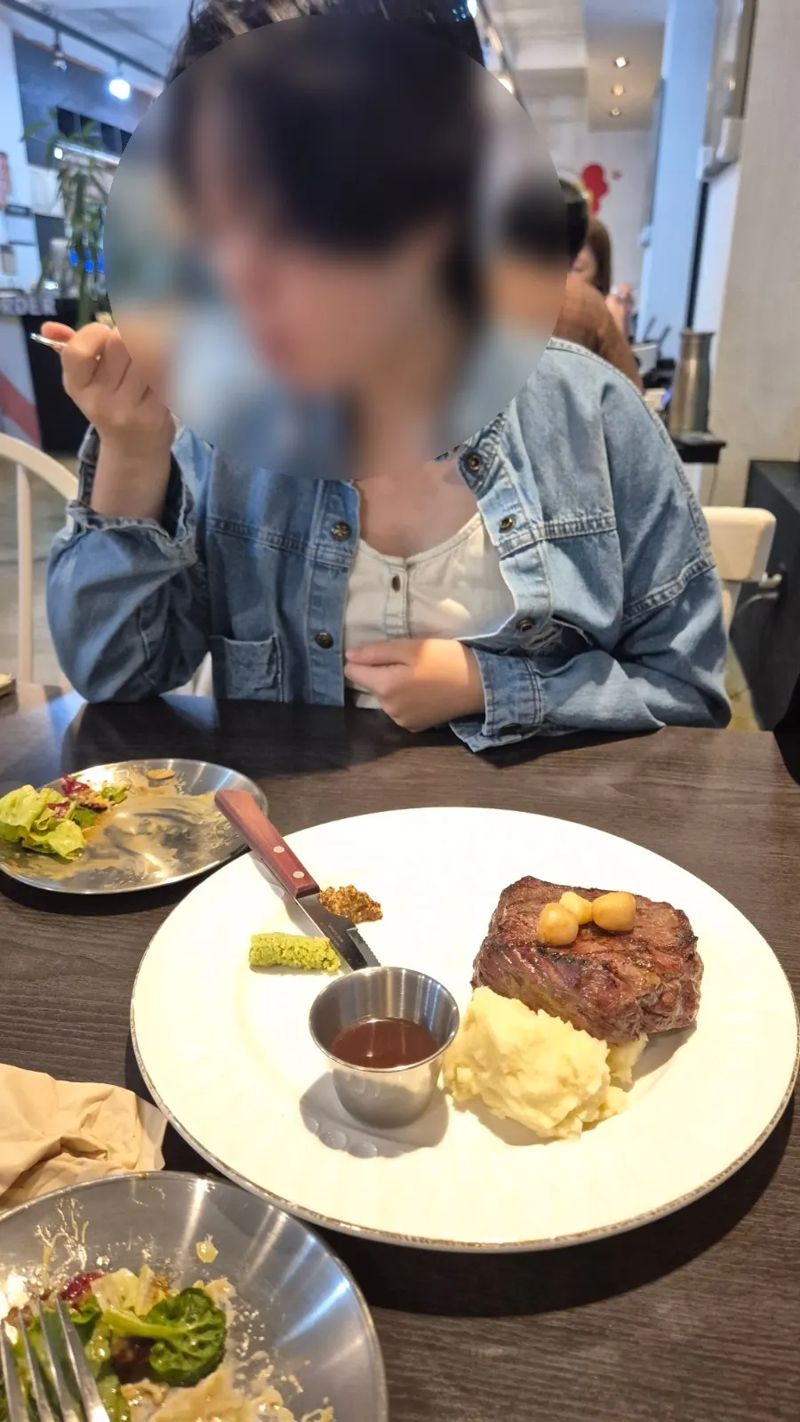 A piece of steak picked up with a fork