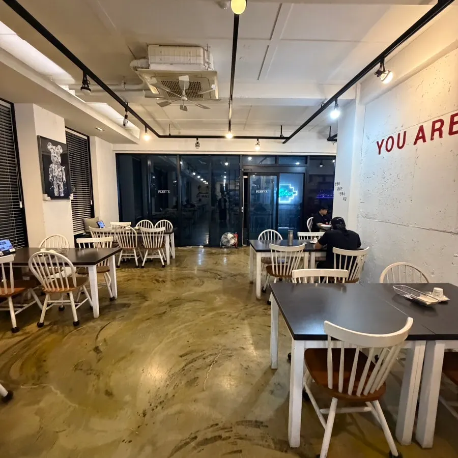 Floor seating area at Plan A Restaurant with wide table spacing