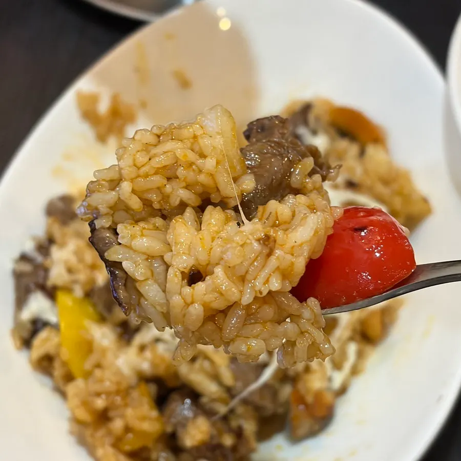 Close-up of tender beef inside the pilaf