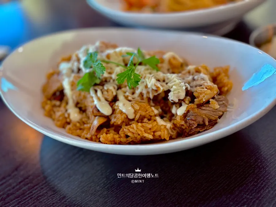Scooping up a bite of the spicy soup pasta
