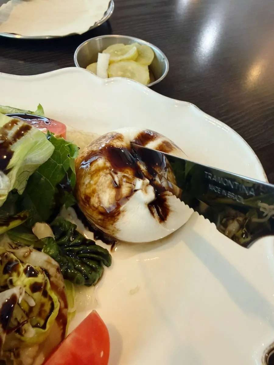 Close-up of the burrata cheese in the salad