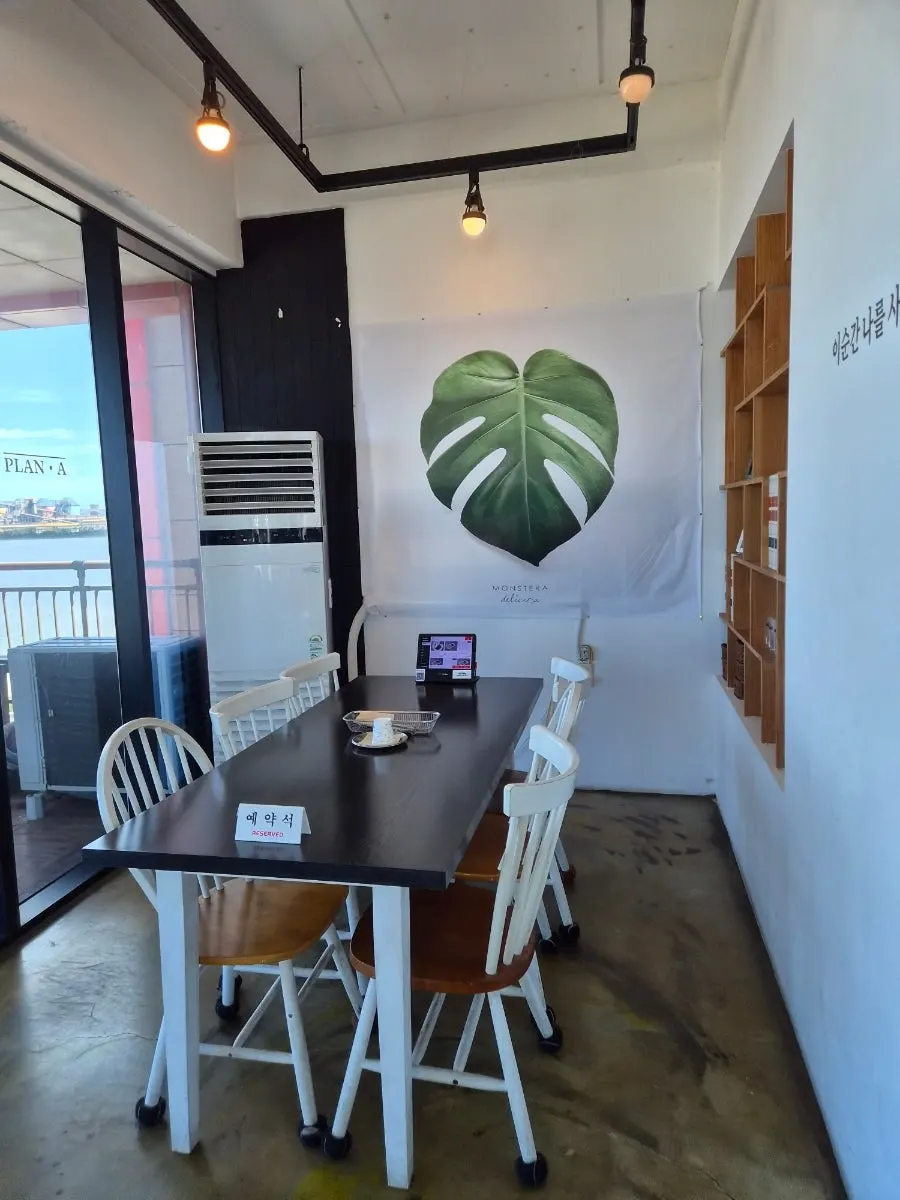 Interior hallway and seating at Plan A Restaurant