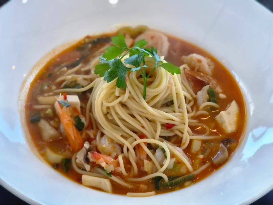 Aglio olio topped with roasted garlic confit