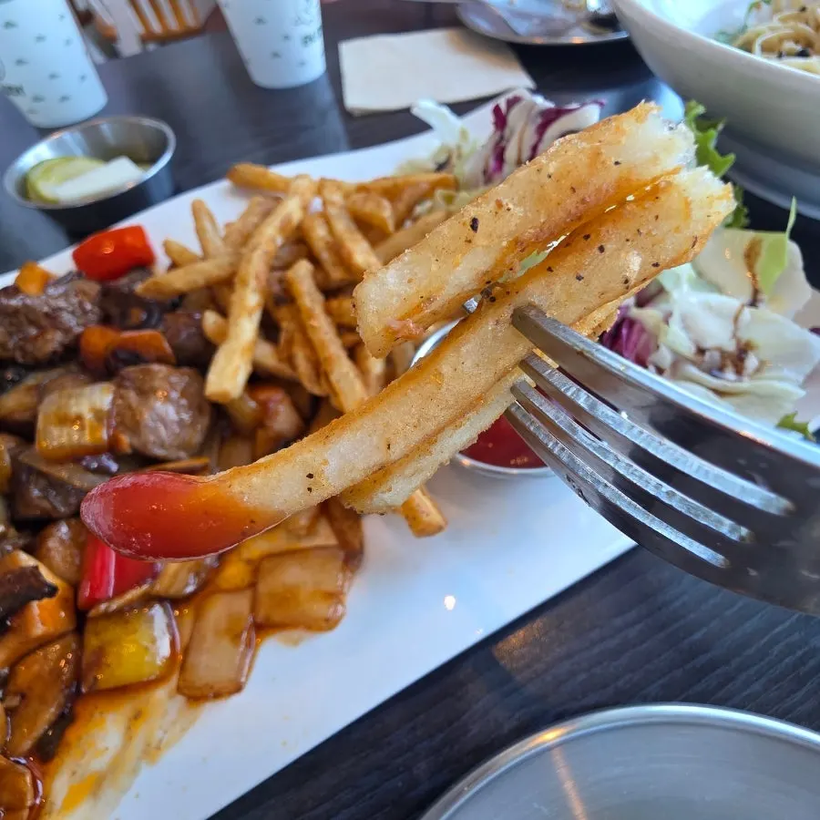 Chop steak served with salad and fries