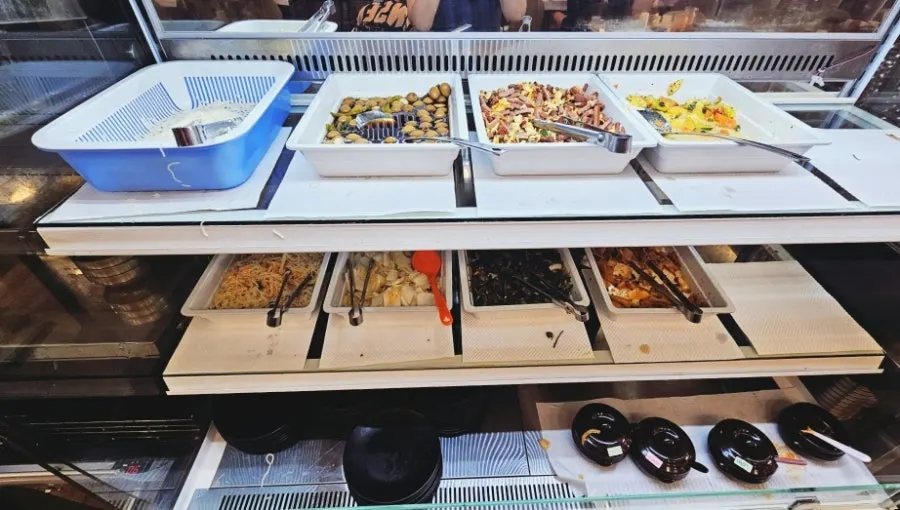 Side dishes laid out at the self-serve bar