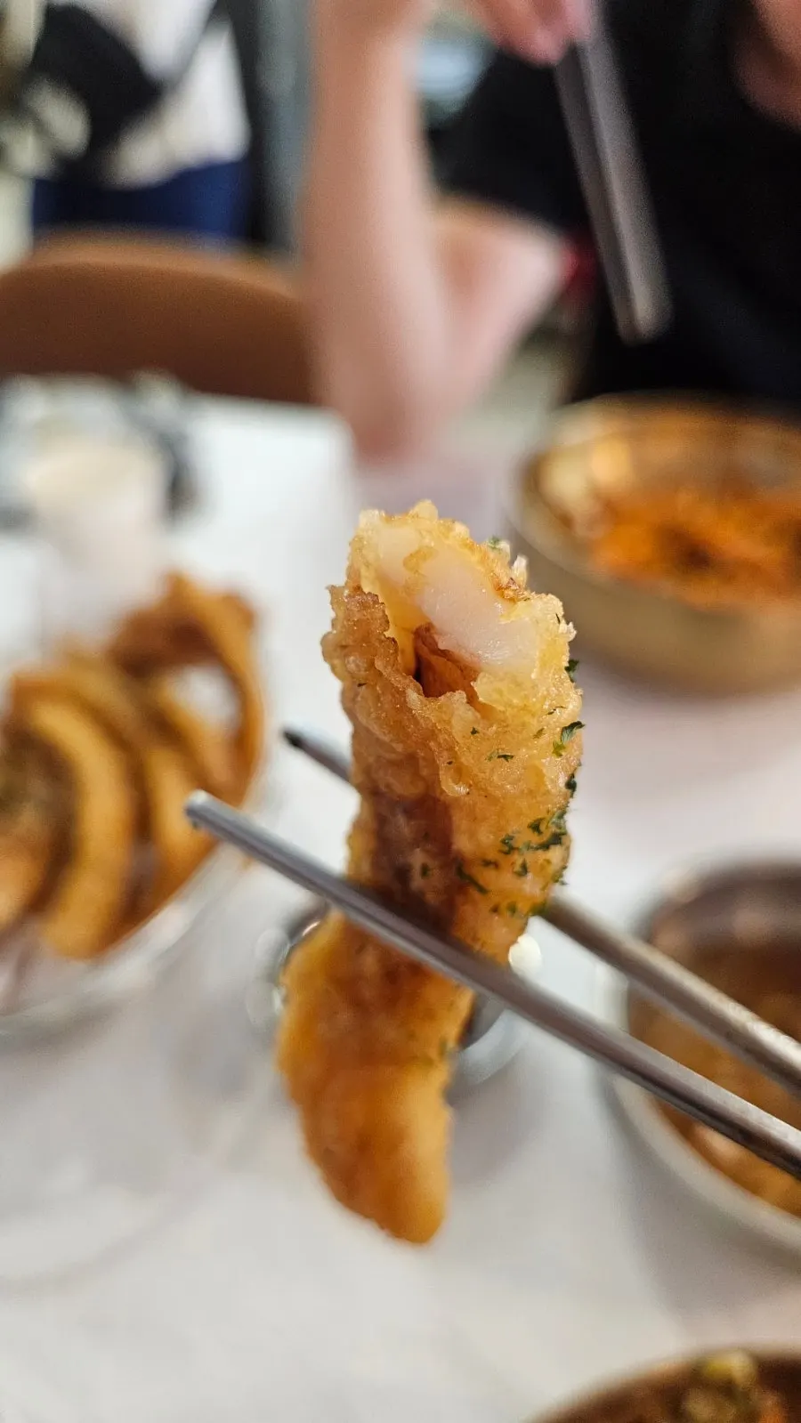Picking up a piece of fried squid