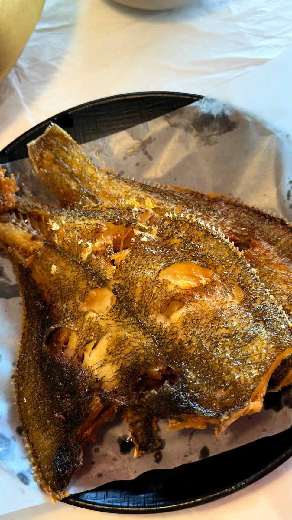 One grilled flounder served per person