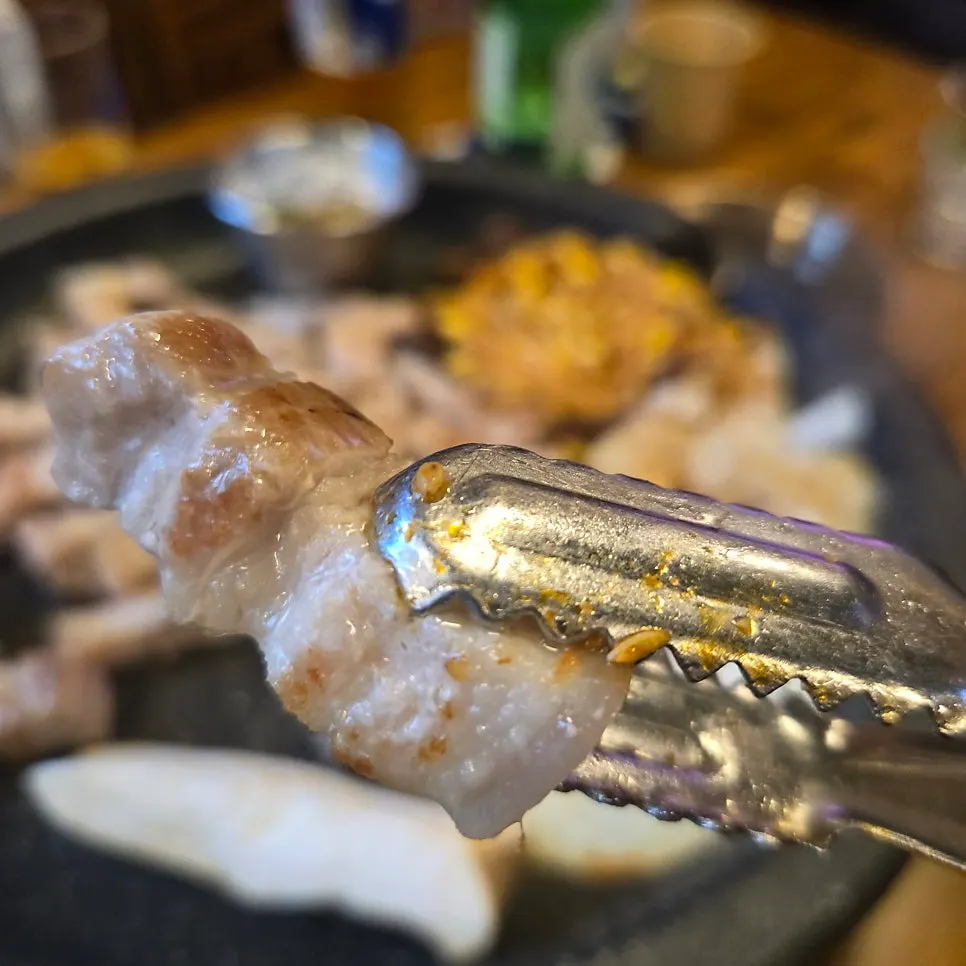 Grilled ogyeopsal with the skin still attached