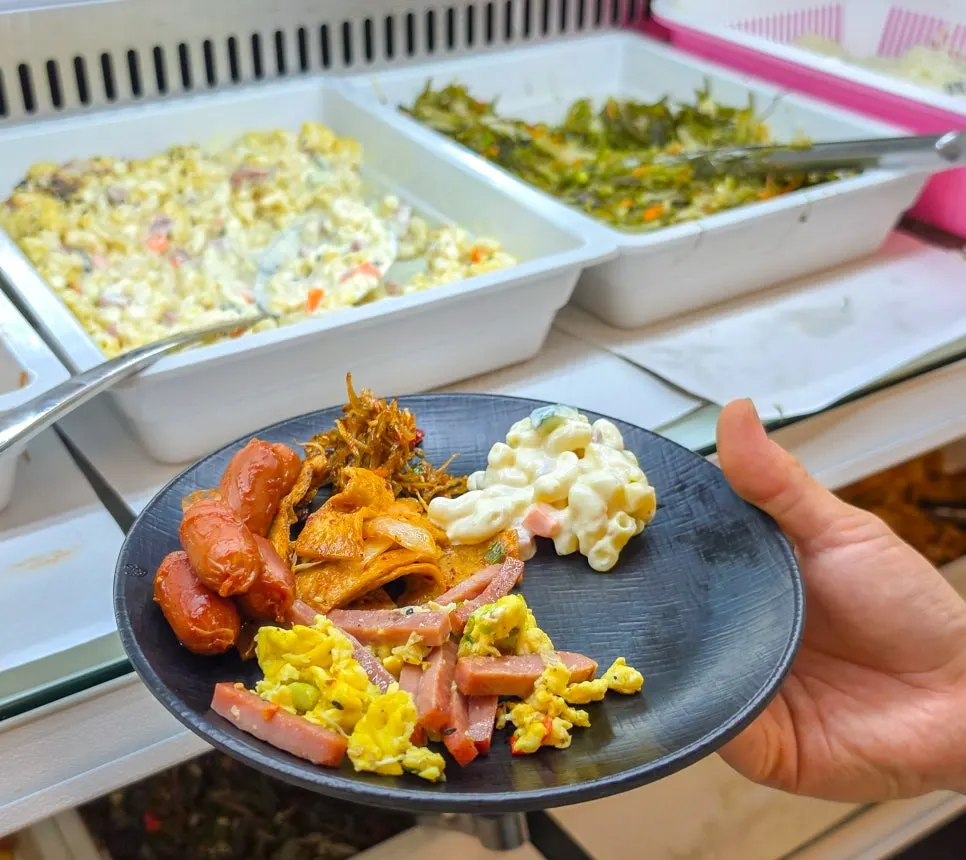 A plate of side dishes taken from the self bar