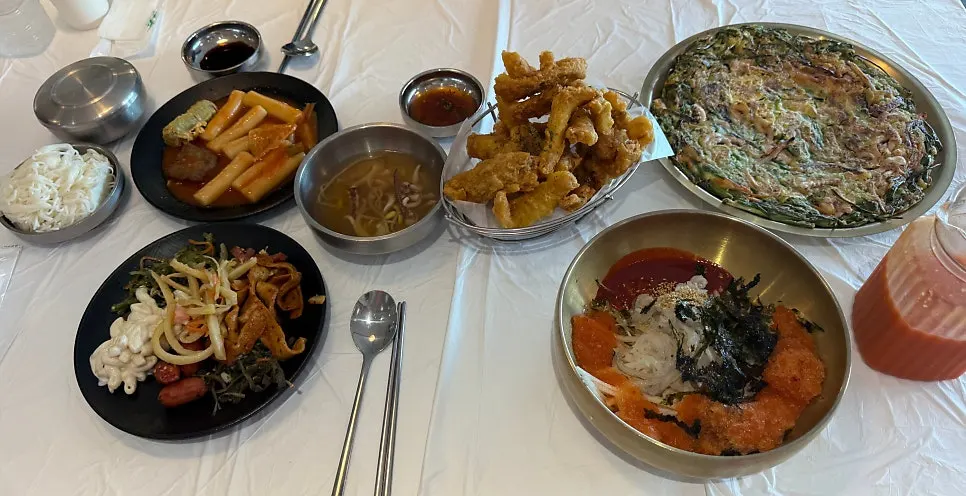 Side dishes and noodles set out on the table