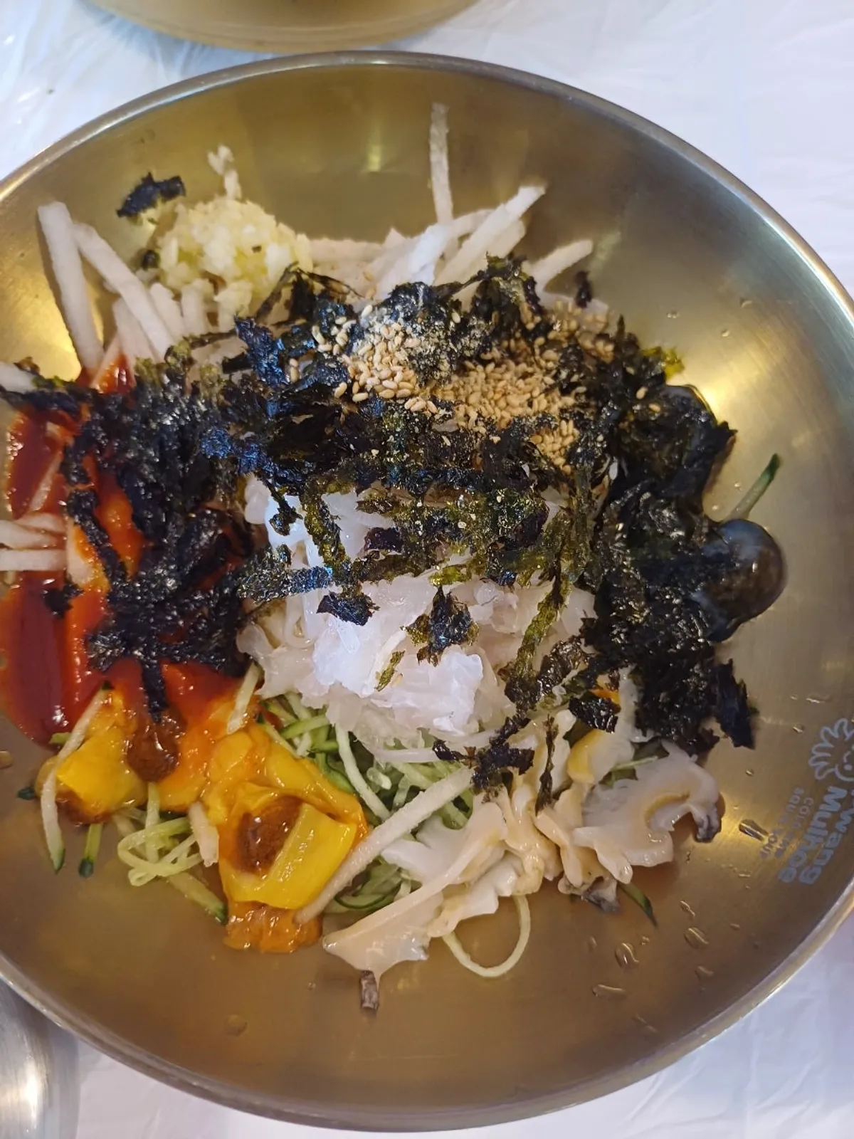 A bowl of the signature mulhoe at Ppwang Mulhoe by Yeongildae Beach, Pohang