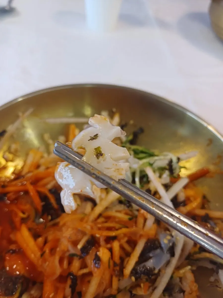 Thinly sliced abalone on top of the mulhoe