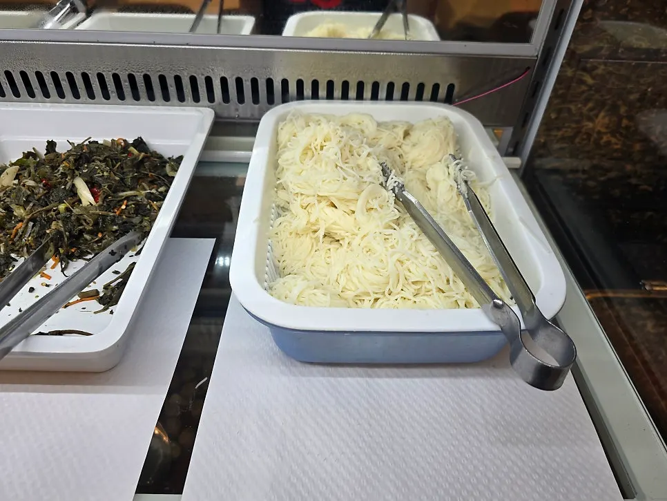 Containers of side dishes at the self bar