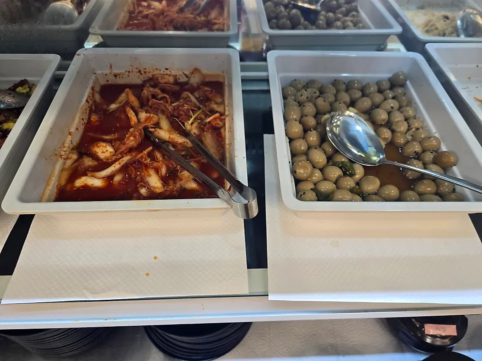 A plate of side dishes gathered from the self bar