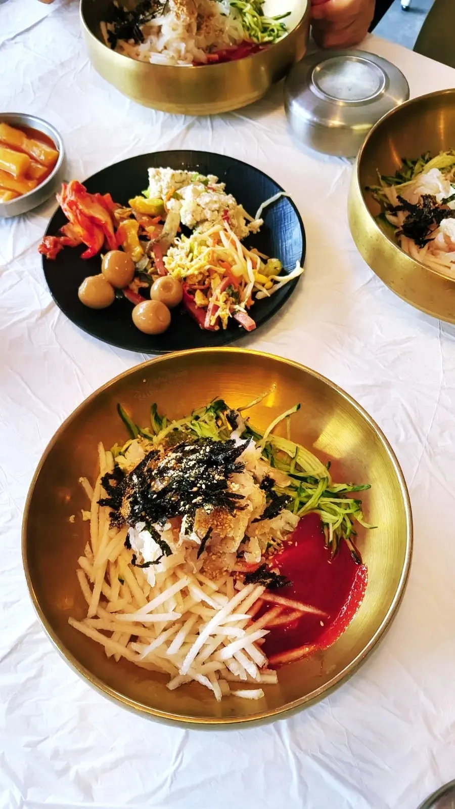 A plate of soup tteokbokki, kimmari, and chicken nuggets brought from the self-bar