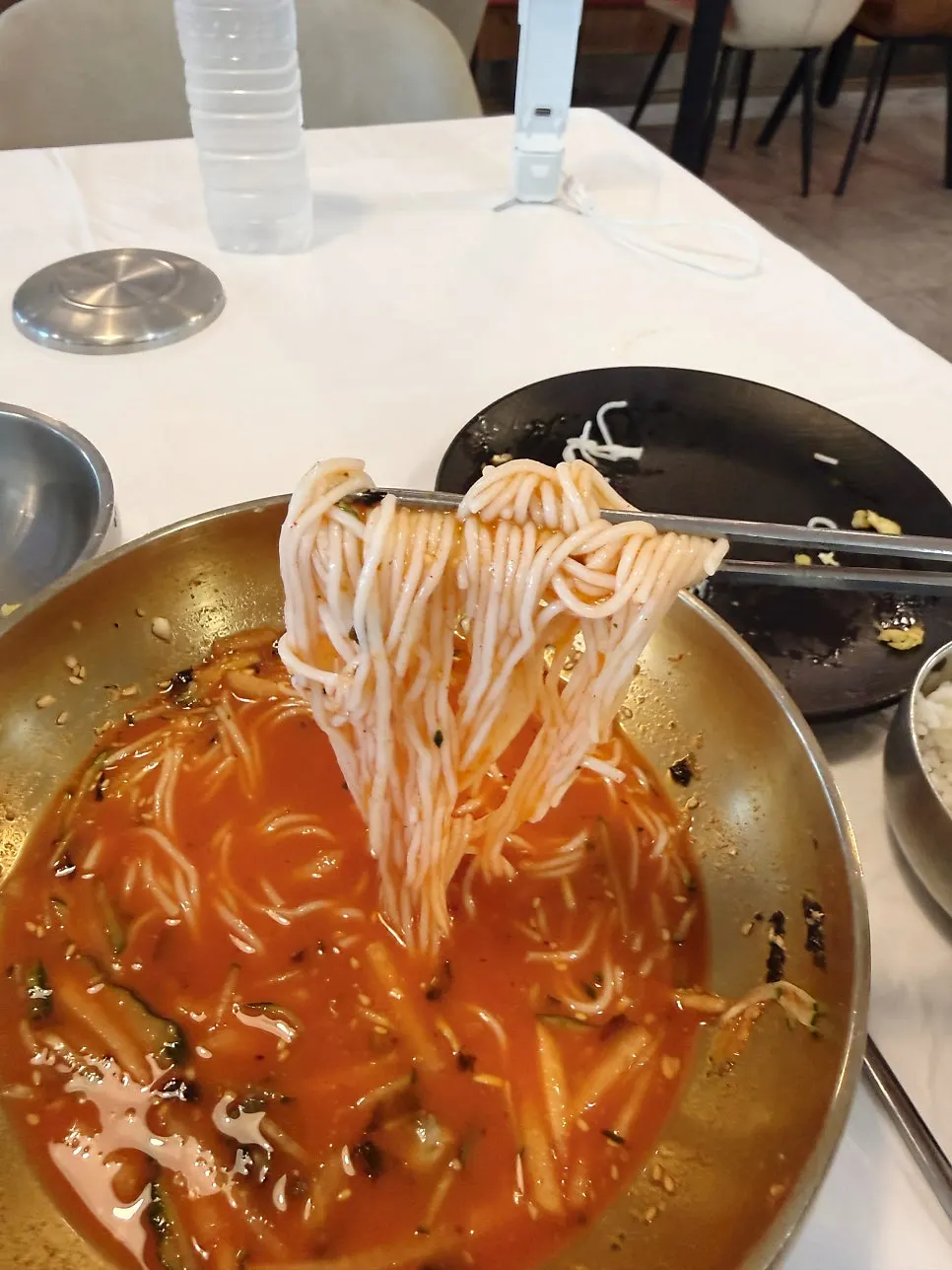 Seafood submerged in the red mulhoe broth