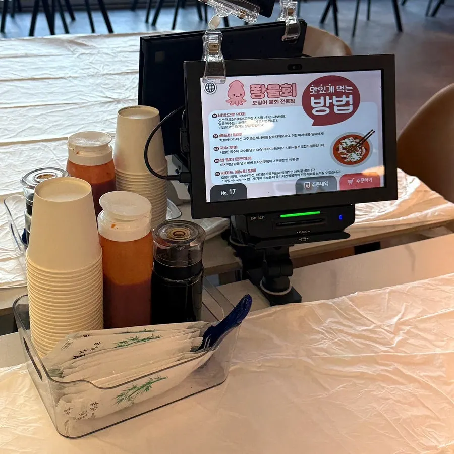 Tablet menu attached beside the table
