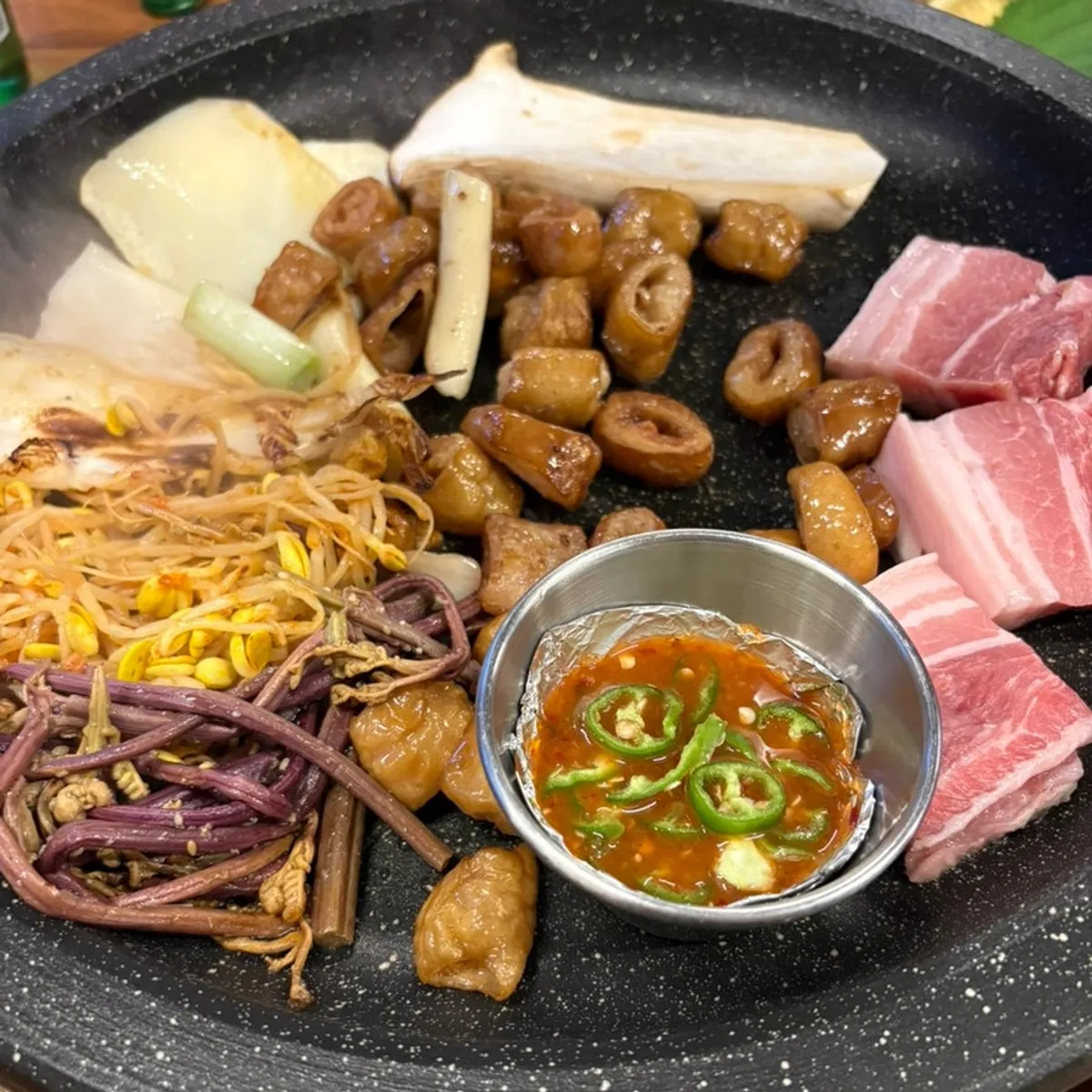 Meat on the grill at Neolpanji Pohang Yeongildae Branch