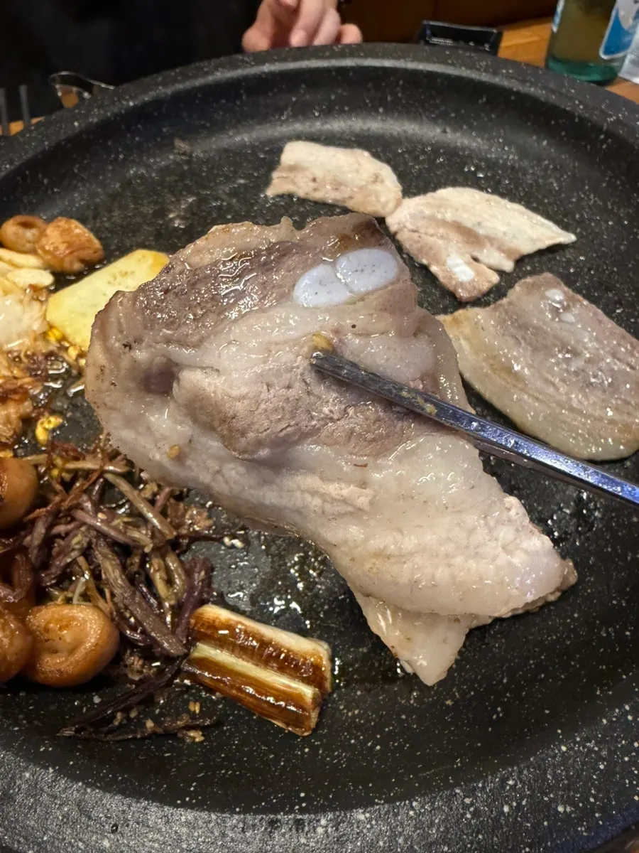 Pork belly browning on the grill