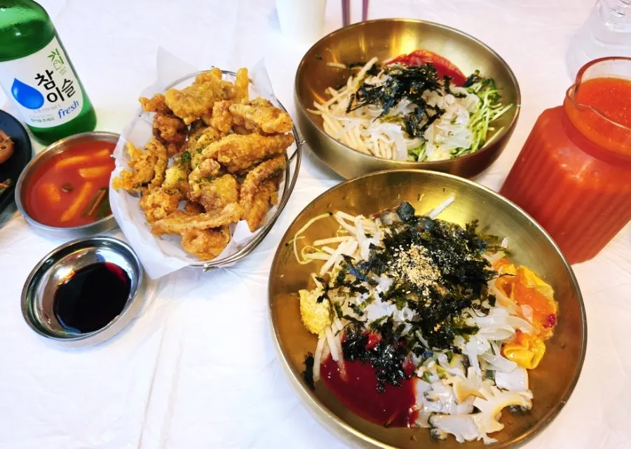 Table set with Ppwang Mulhoe, squid mulhoe, and fried squid