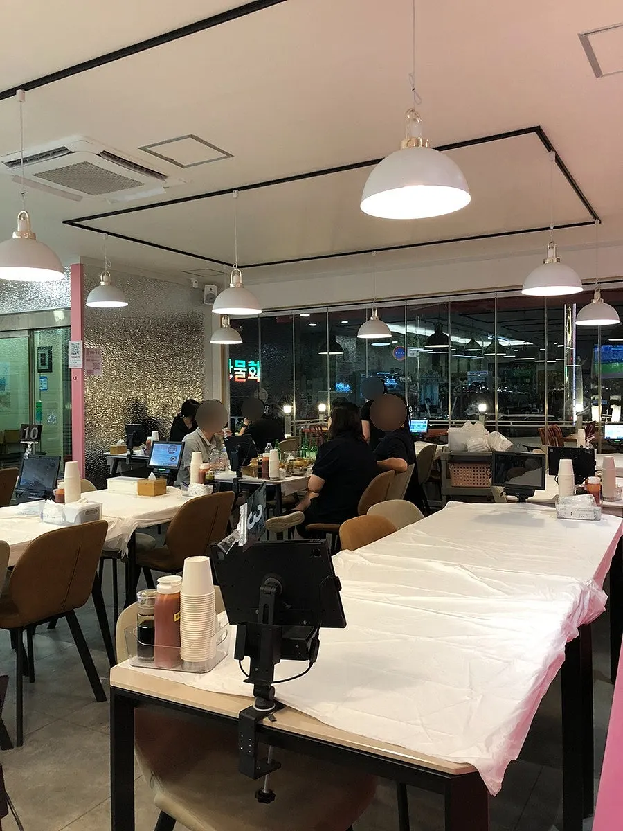View of the Ppwang Mulhoe dining hall with well-spaced tables