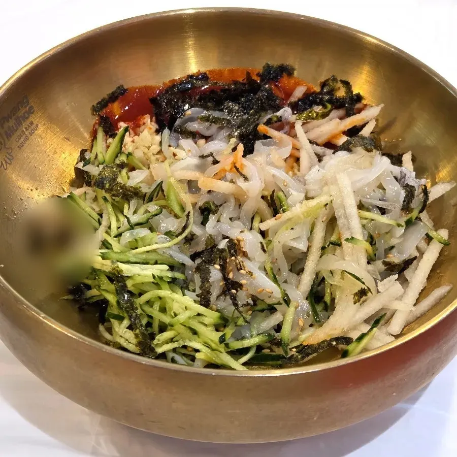 Squid mulhoe served with broth and a bowl of rice