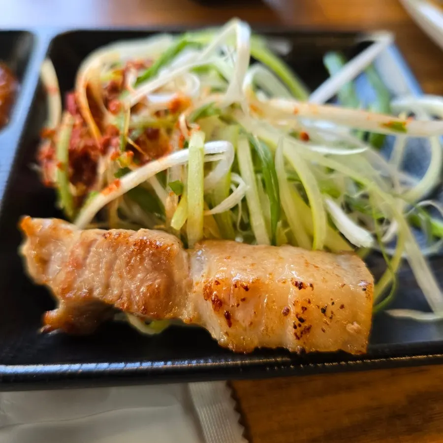 A fully grilled piece of aged ogyeopsal