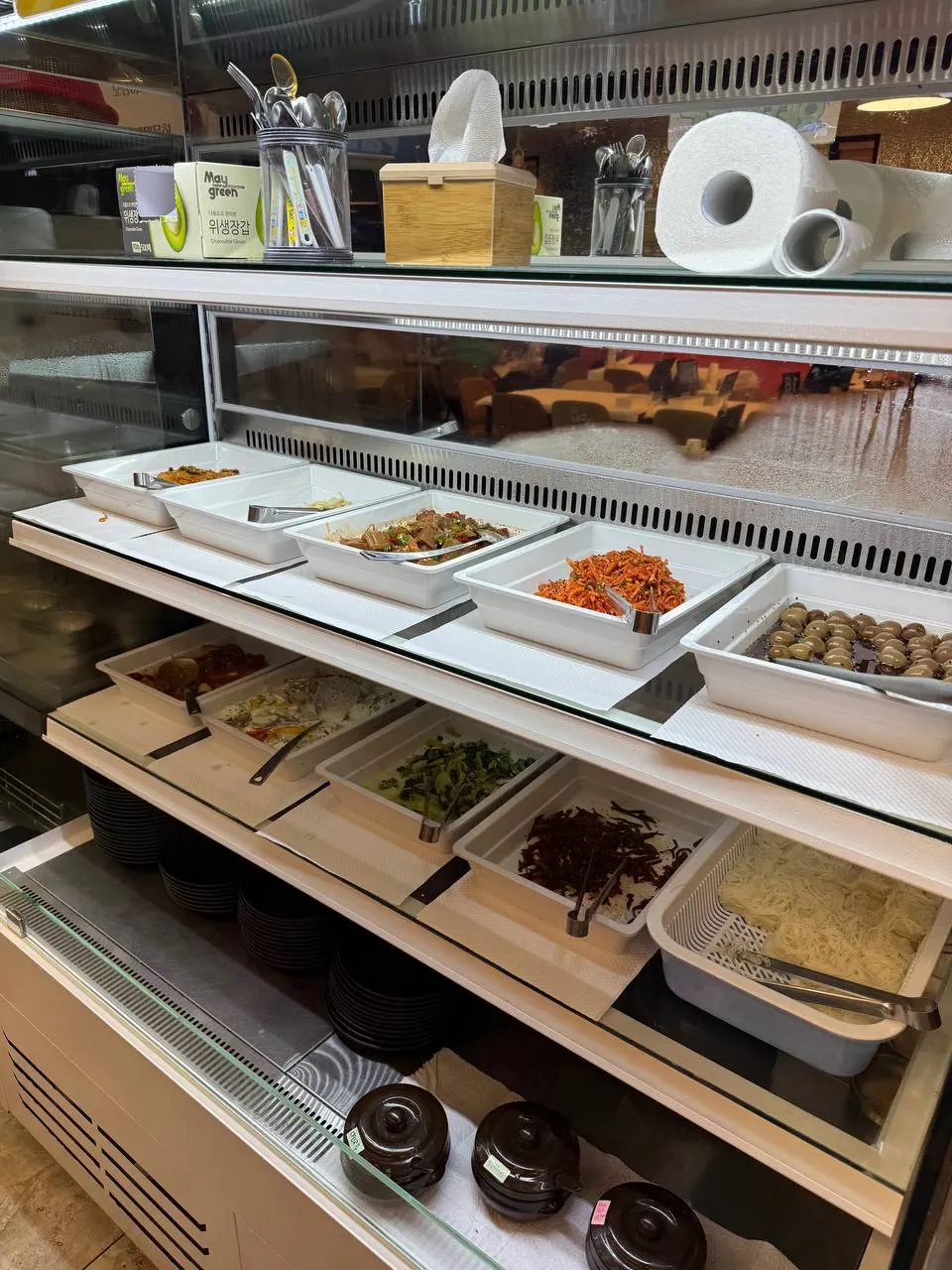 Tteokbokki and side dishes at the self-serve bar