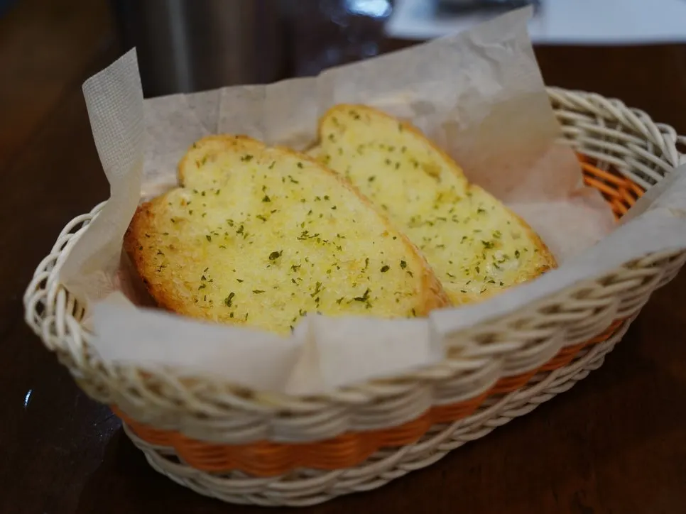 Warm garlic baguette served before the meal