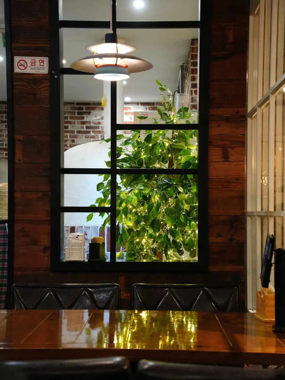Polia's interior with brick walls and a wine rack