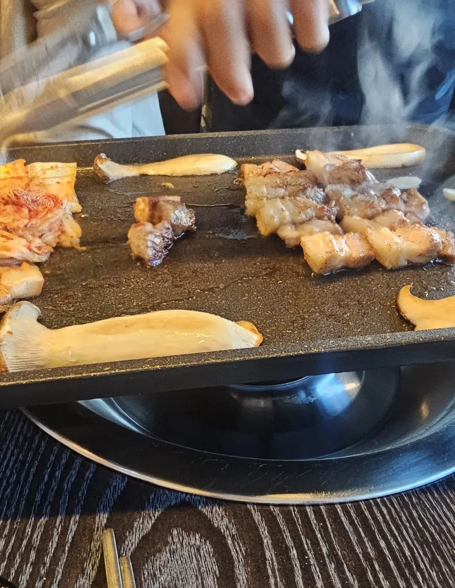 Interior of the Korean BBQ restaurant packed with evening diners