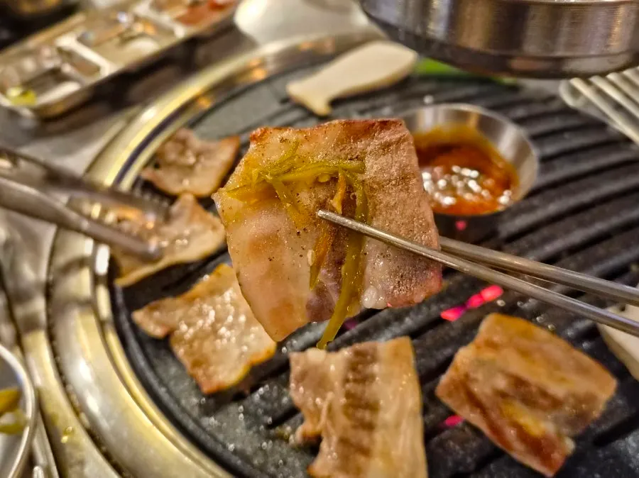 Frozen pork belly topped with pickled gochujang radish