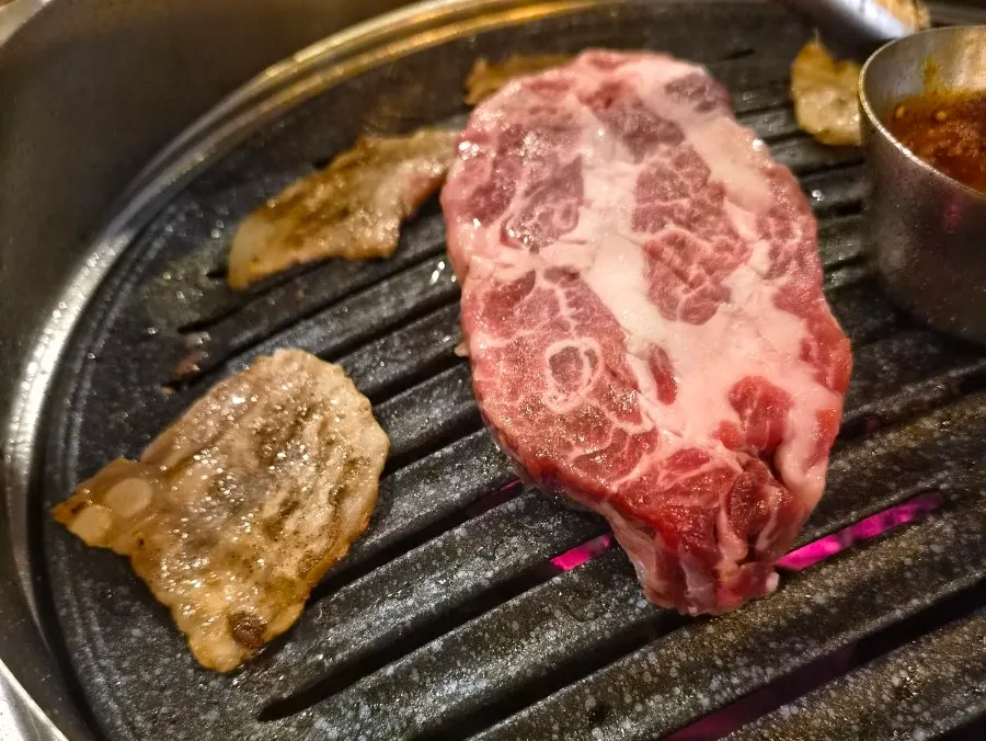 Raw Iberico thick-cut pork neck before grilling