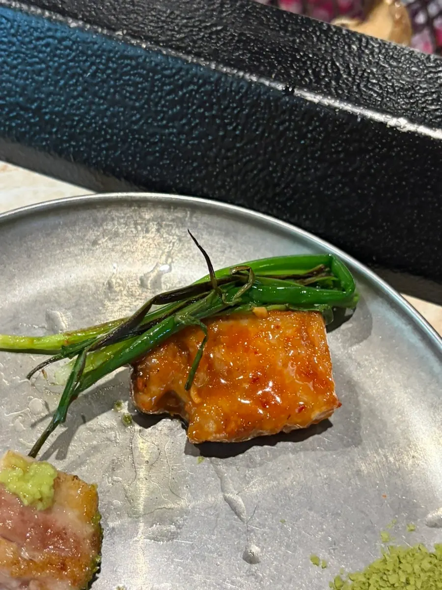 Black pork served with grilled scallion